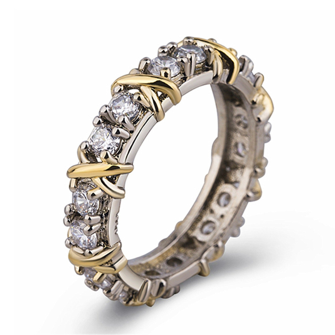 Ring van Koper met Kruisdetails en Gefacetteerde Inzetten