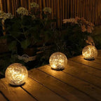 Solar Glasbol met Warm LED‑Licht en Gebarsten Glasstructuur