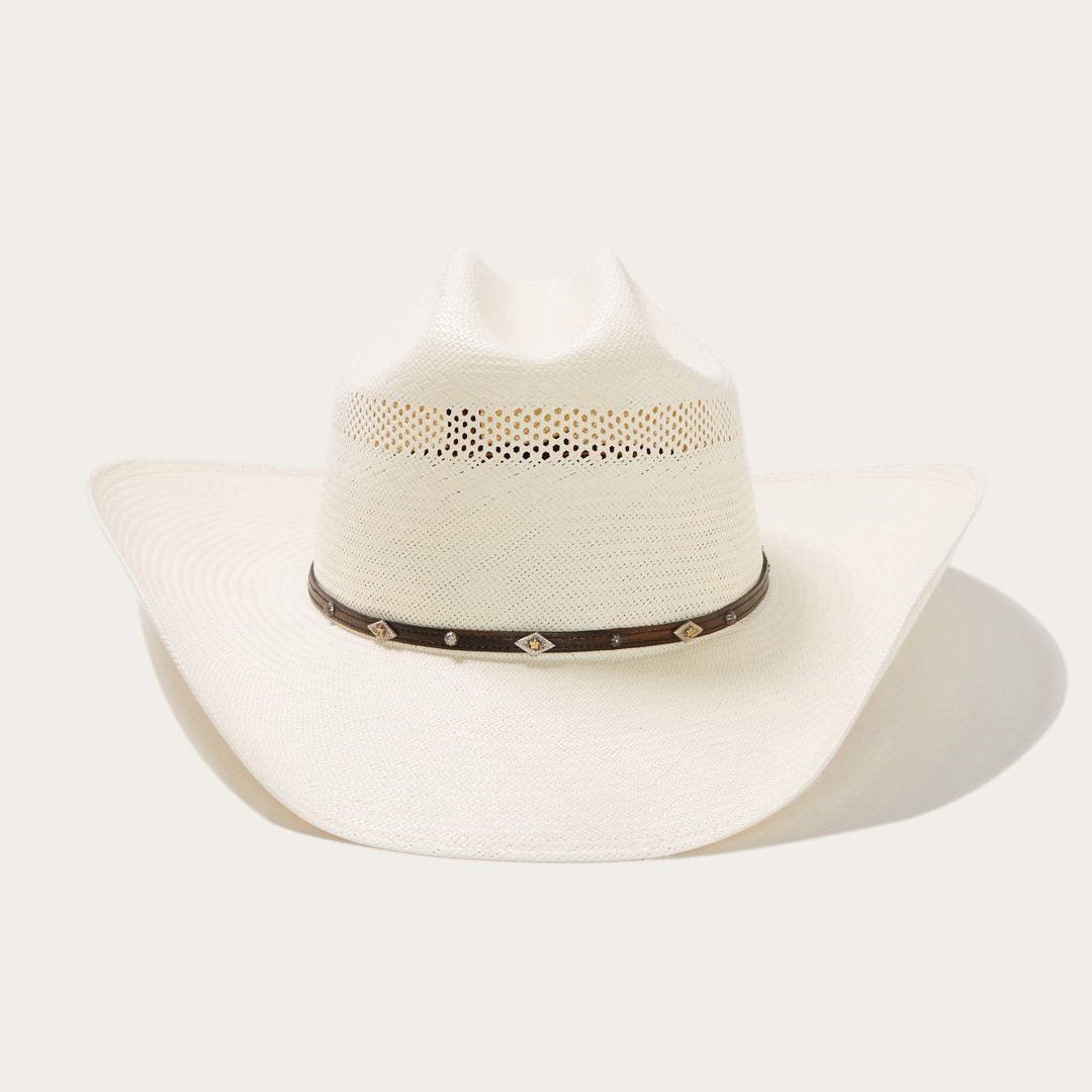 Gevlochten cowboyhoed van stro met decoratieve hoedband