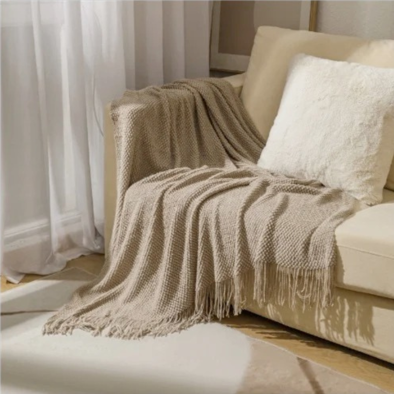Luxe Merino‑Stijl Deken met Zachte Structuur en Decoratieve Kwastjes voor Warmte en Sfeer