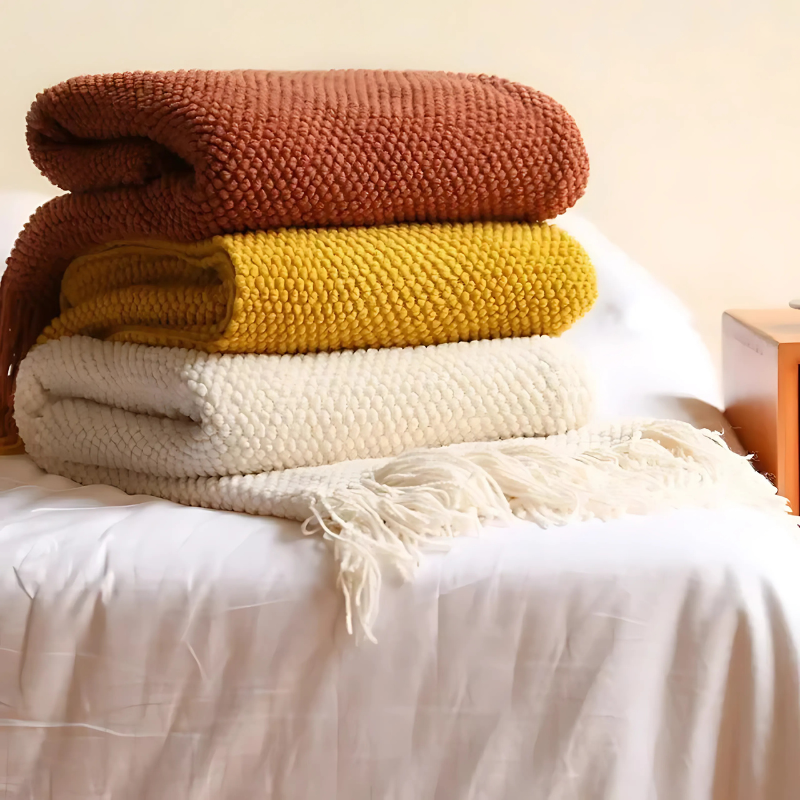 Luxe Merino‑Stijl Deken met Zachte Structuur en Decoratieve Kwastjes voor Warmte en Sfeer